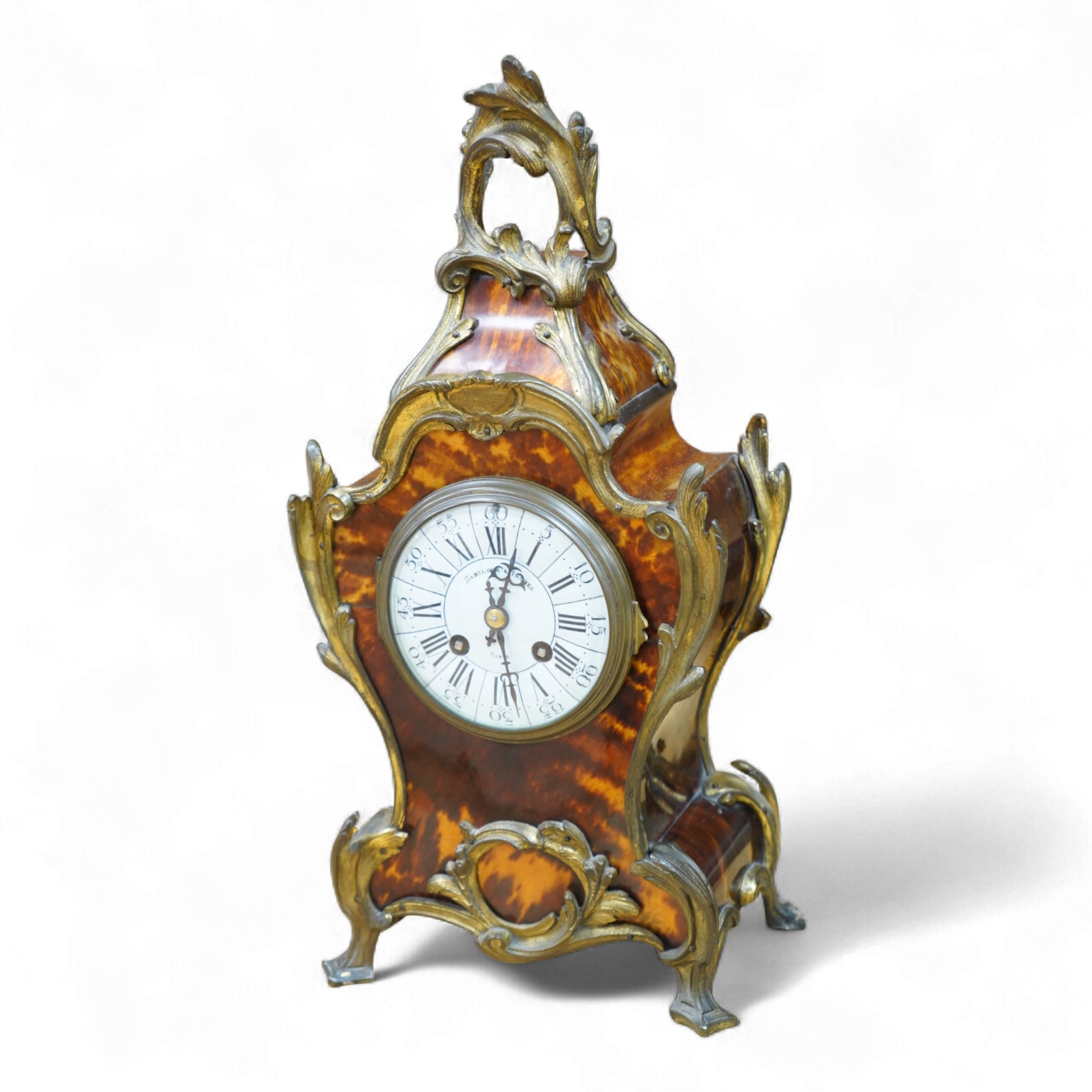 A Louis XV style tortoiseshell and ormolu-mounted mantel clock with pendulum and key, the dial inscribed Hamilton & Inches, Paris, 41cm high